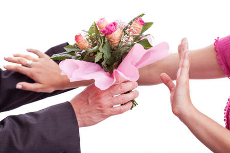 A couple fighting over a bouquet of unwanted roses