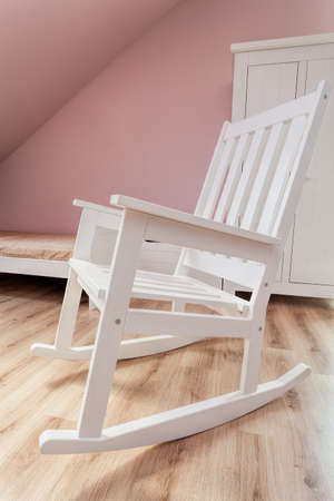 Urban apartment - white rocking chair in girl's roomの写真素材