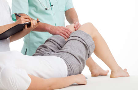 Doctors diagnosing a girl leg ponds disease 