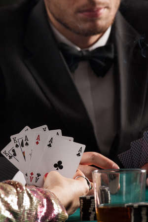 Aces and kings in womans hands in casino