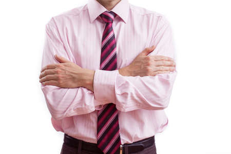 A man having his arms crossed showing his distanceの写真素材