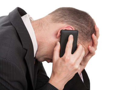 A young businessman having a very stressful conversationの写真素材