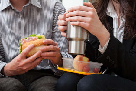 Break from work to have lunch in the office and conversationの写真素材