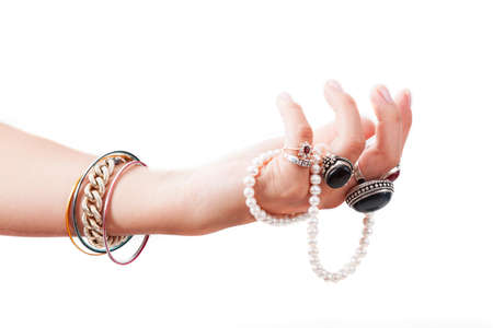 A hand full of bracelets and expensive vintage ringsの写真素材