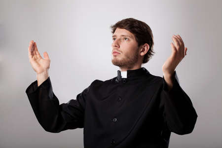 Cleric worshiping God with all his heartの写真素材