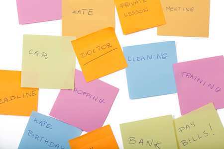 A lot of sticky papers with daily family tasks sticked on fridge