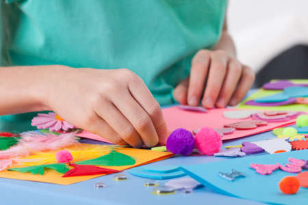 Little boy making artworks on art lesson at kindergarten