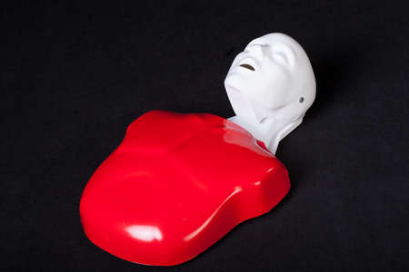 A red and white plastic phantom used to practise resuscitation
