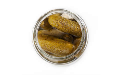 Pickles in a jar isolated on white backgroundの写真素材