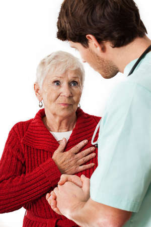 Doctor listening about problems of his elderly patientの写真素材