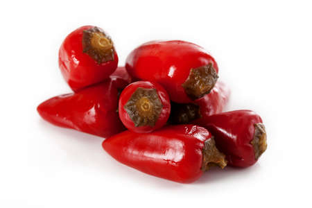 A pile of chilli peppers isolated on white background