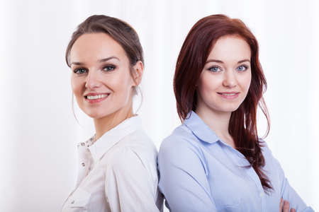 Young, pretty and smiling female friends, horizontal