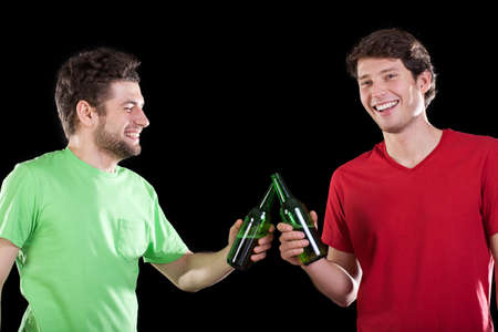 Men friends celebrating and drinking beer, horizontalの写真素材