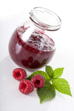 Fresh raspberries and jar with homemade jam