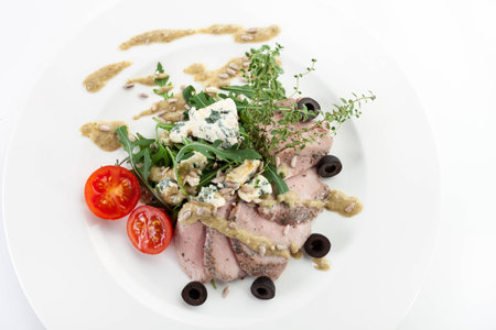 Meat vegetable dish with blue cheese in sunflower dressingの写真素材