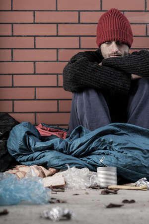 Sad man without home living on the streetの写真素材