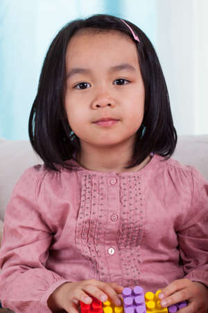 Portrait of a cute little asian girl, vertical