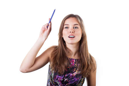 Female student raising hand with pen to asking the questionの写真素材