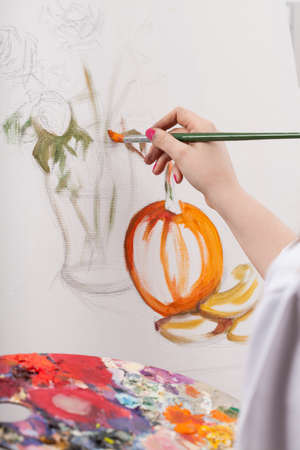 Female painted still life with colored paintsの写真素材