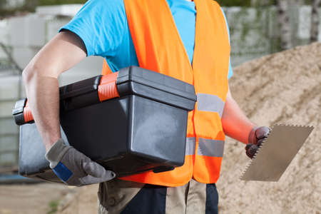 Engineer with toolbox at building area, horizontalの写真素材