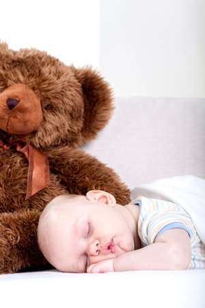 Vertical view of a sleeping little babyの写真素材