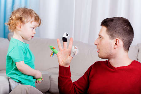 Young dad's playing with his lovely sonの写真素材