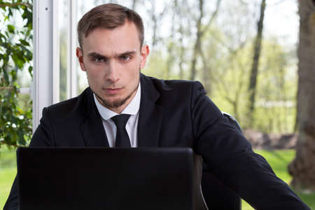 Young businessman working with computer at officeの写真素材