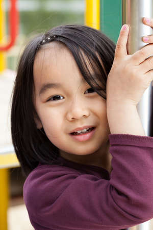 Asian little child is playing at playgroundの写真素材