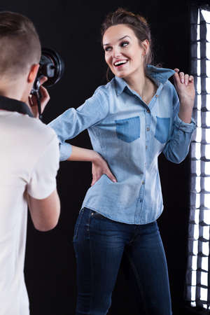 Photographer and young model working during photo sessionの写真素材