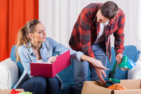 Young couple preparing themself to moving house
