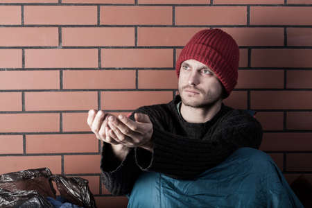 Unemployed beggar living on the street, horizontalの写真素材