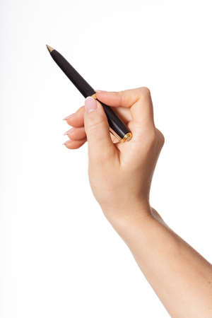 Hand holding black pan on isolated backgroundの写真素材