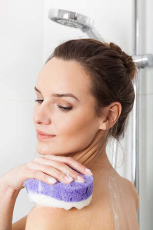 Woman taking a shower in the bathroom