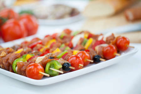 Delicious colorful meat skewers on summer barbecue partyの写真素材