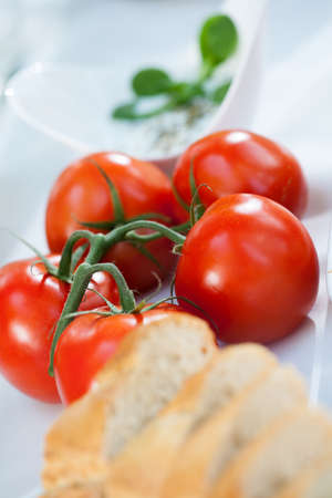 Beautiful fresh tomatoes on the table on grill partyの写真素材