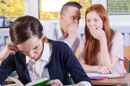 Horizontal view of students gossip on a lesson