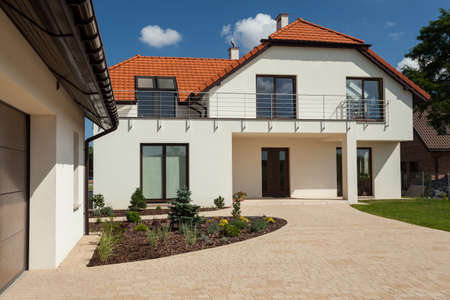 Horizontal view of big house with outbuilding Horizontal view of big house with outbuilding