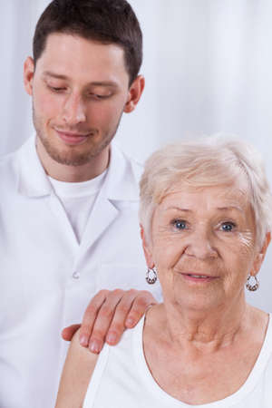 Closeup of doctor and his geriatric patientの写真素材