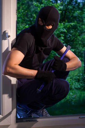 Burglar ready to break into the houseの写真素材
