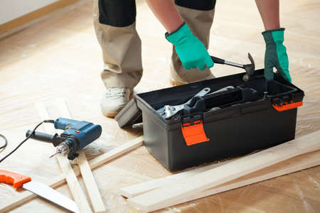 Man with toolbox during renovation at homeの写真素材