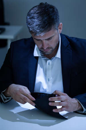 Vertical view of a businessman having depression