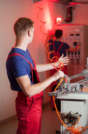 Fire alarm ringing in factory during accident, verticalの写真素材