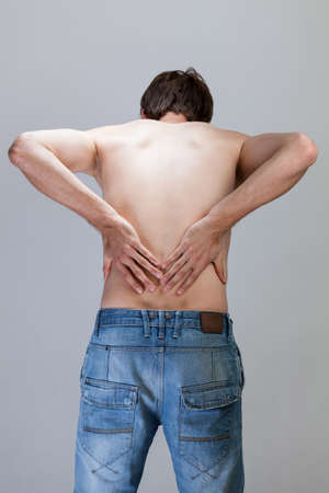 Vertical view of a man feeling backache