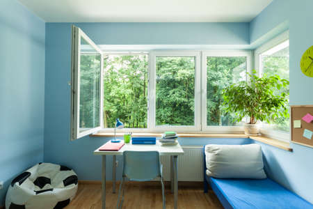 Interior of child room with open windowの写真素材