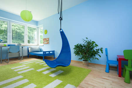Interior of child room with hanging chairの写真素材