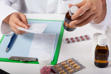 Horizontal view of pharmacist working in pharmacyの写真素材