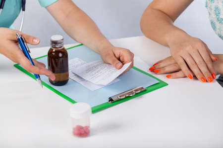 View of doctor with prescription for patientの写真素材