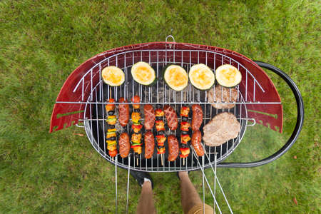 Delicious food grilling on a grill, horizontalの写真素材