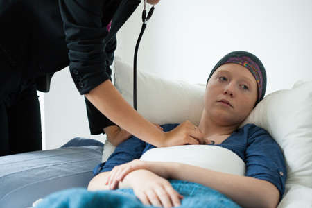 Horizontal view of examining woman with cancer