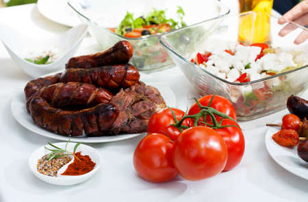 Table full of snacks on a garden partyの写真素材